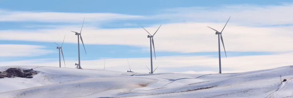 Wind turbines in winter with icing on the blades