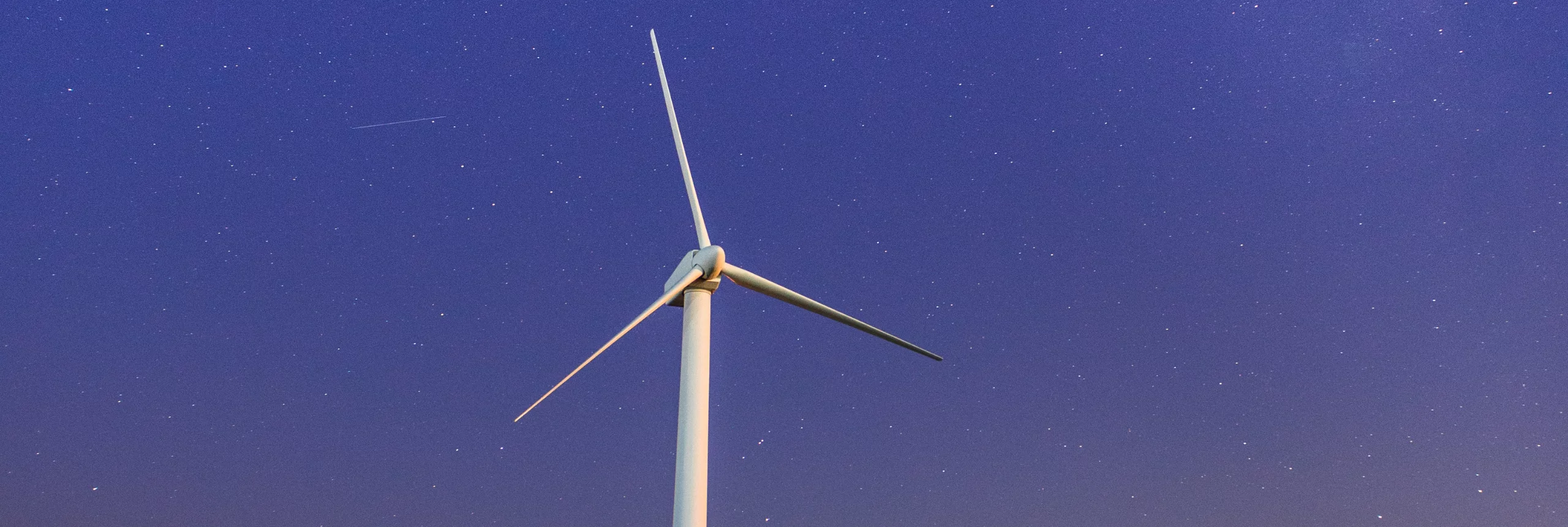 Wind turbine in the night sky